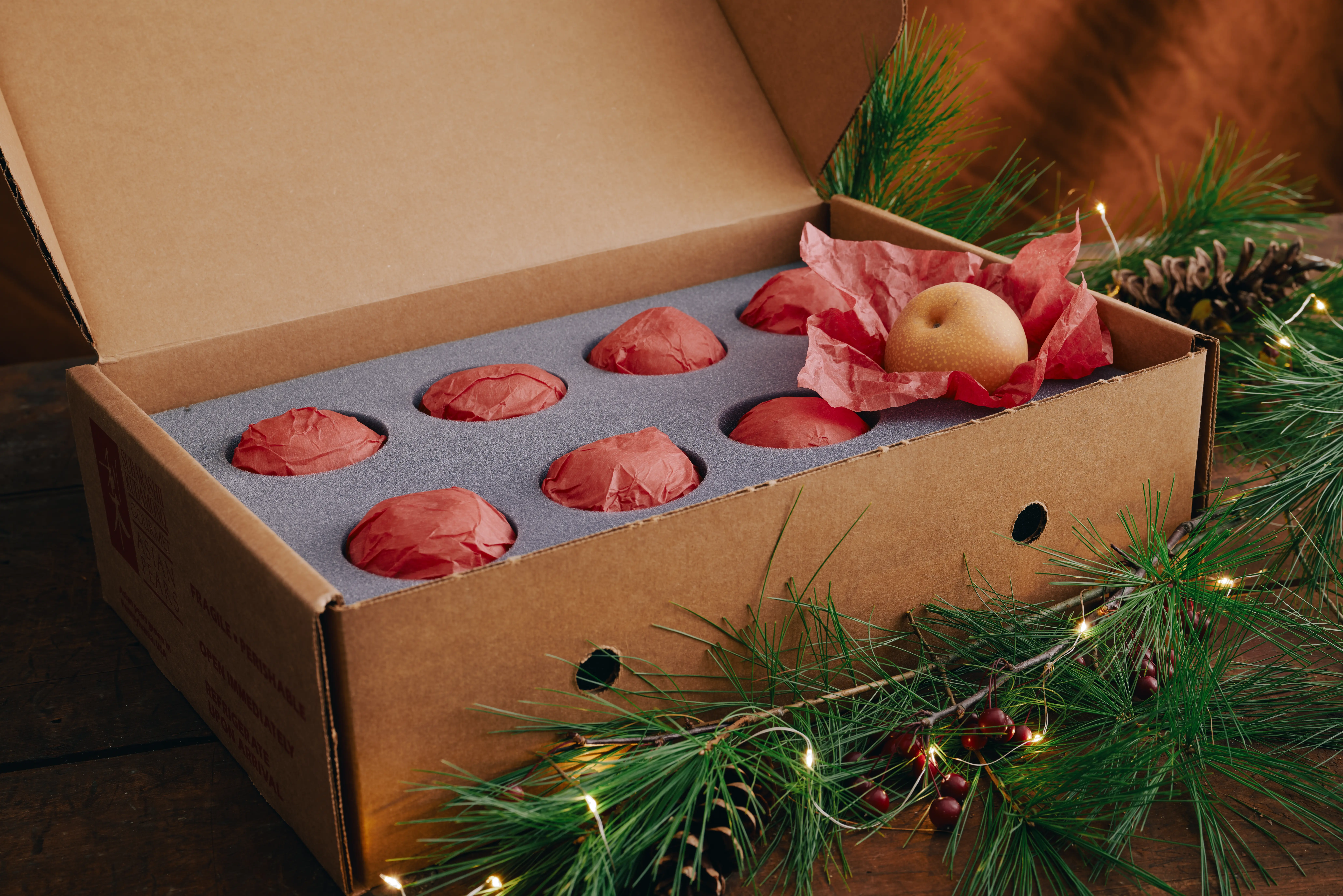 Holiday pears wrapped in a gift box